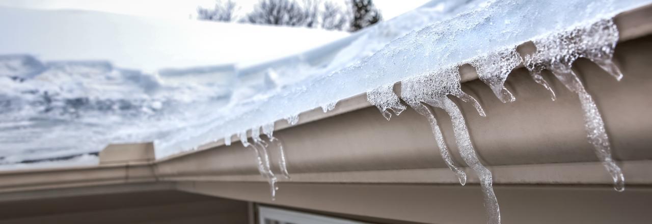 ice dam buildup on side of home
