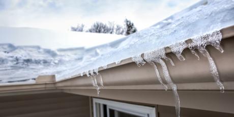 ice dam buildup on side of home